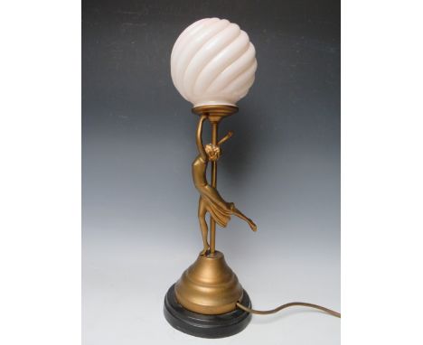 AN ART DECO FIGURAL SPELTER TABLE LAMP IN THE FORM OF A DANCING LADY, with gilt finish, circular period shade, overall H 50 c