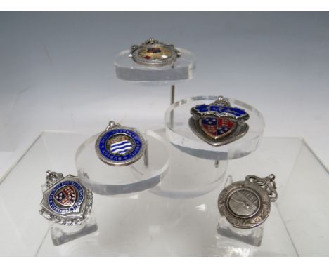 A COLLECTION OF FOUR EARLY 20TH CENTURY HALLMARKED SILVER AND ENAMEL FOOTBALL FOB MEDALS, comprising three examples for Walsa