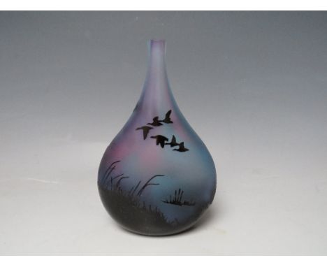 AN ED BURKE E &amp; M STUDIO GLASS SCENIC VASE, black cased, being acid etched to reveal a blue and purple tonal ground with 