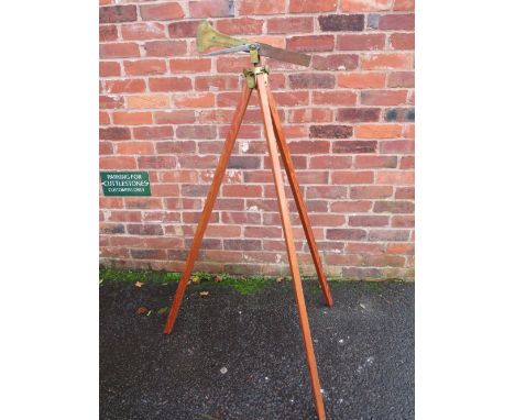 A 19TH CENTURY BRASS SURVEYORS LEVEL BY EDWARD MEIR, of 16 Bath Place, New Road, London, complete with wooden tripod, H 130 c