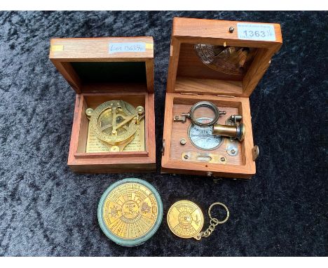 Two Sundial Compasses, in fitted wooden boxes, together with a desk top and pocket calendar.