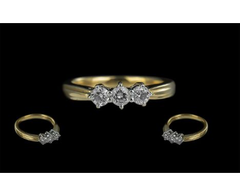 Ladies Modern 18ct Gold 3 Stone Diamond Set Ring, marked 750 - 18ct to shank.  The three brilliant cut diamonds of top colour