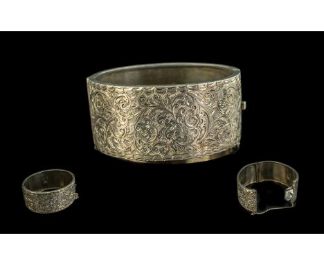 Large Edwardian Silver Hinged Bangle with safety chain, an impressive piece of jewellery with floral decoration, hallmarked B