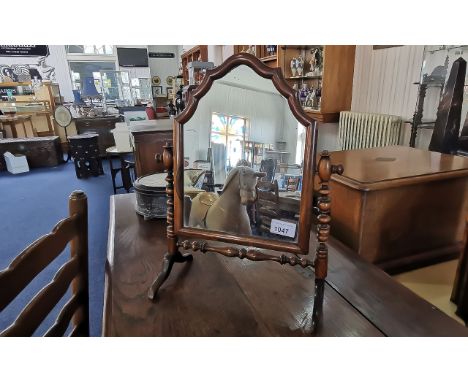 Georgian Freestanding Mirror, walnut, shaped form, domed top, bobbin supports.  Measures 15.5'' high x 11'' wide.