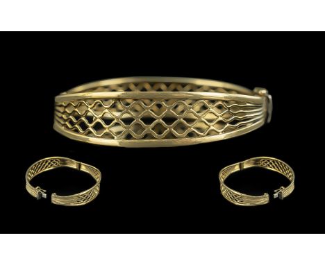 Ladies Attractive and Superior 9ct Gold Openwork Hinged Bangle with safety chain, marked 9.375, diameter 2.5 inches (6,25cms)