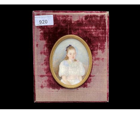 Early 20th Century Portrait Miniature, depicts a young girl in lace dress, housed in a velvet frame.