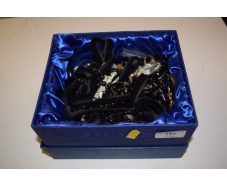 A box containing mother of pearl and other buttons, jet and other beads etc. 