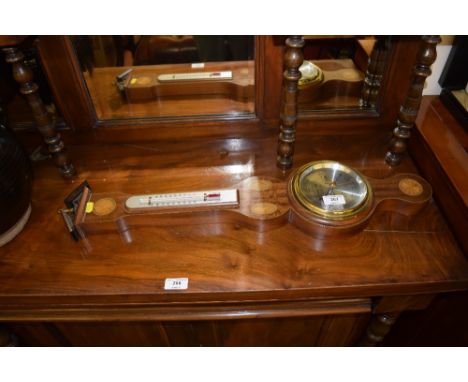 A mahogany and inlaid cased barometer 