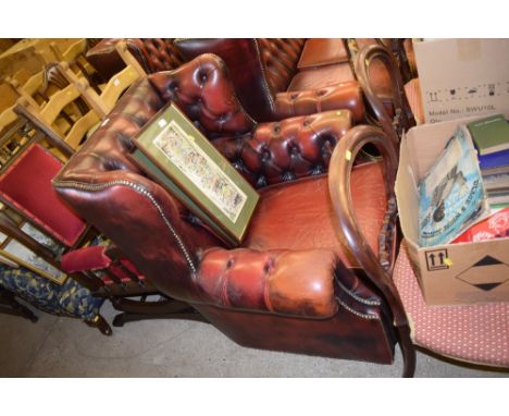 A Chesterfield style button back upholstered armchair 