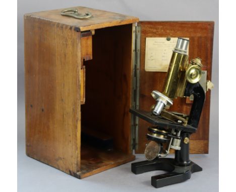 A vintage C. Reichert Wien black lacquered &amp; brass monocular microscope (no. 43342), with a mahogany case. 
