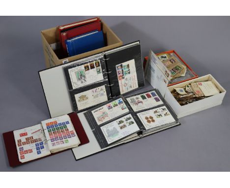 A collection of 130 GB First Day covers, 1948-1935, in two albums; and various GB &amp; foreign stamps in albums &amp; loose.