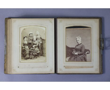 A vintage leather-bound family photograph album containing forty carte-de-visite portrait studies. 