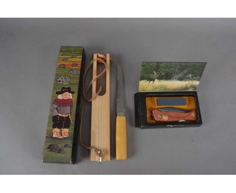 A Swedish Puuko Knife,  with sheath and in a retail box, together with a boxed Swede 60 pocket knife (2) *Please note you hav