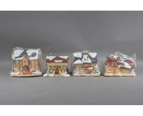 Four M.J. Hummel novelty ceramic houses, all of differing sizes and styles, marked to the undersides, with certificates and p