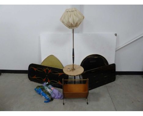 Four c1960s coffee table tops, with screw on legs, together with a c1960s lamp stand and a magazine rack