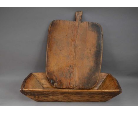 Two items of treen, comprising a large breadboard with handle 66cm, and a rectangular trough, 71cm in length, AF (2)