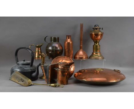 A collection of copper and brass items, including hot water containers, a paraffin lamp, 33cm high, a metal teapot, 28cm high