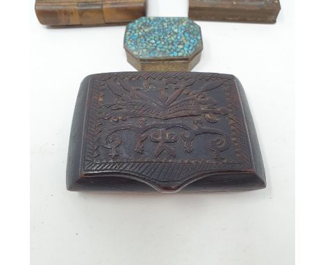 A 19th century treen snuff box, the top carved with stylised foliate fawns, 10 cm wide, and five other snuff boxes (6) 