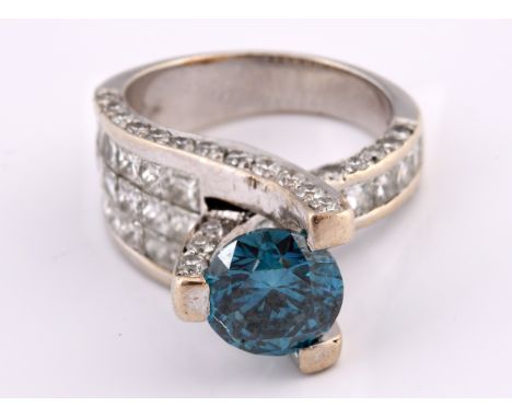 A 14ct white gold, white diamond and blue diamond ring, by Sophia Fiori, ring size I 