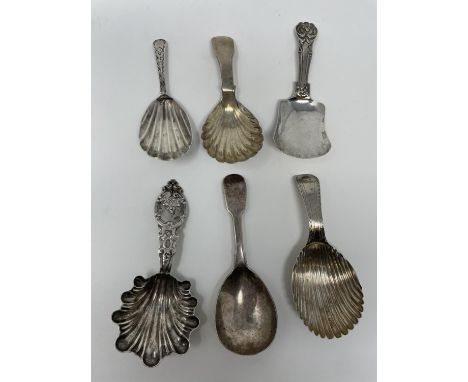 A George III silver caddy spoon, London 1791, four other silver caddy spoons and a Continental silver coloured metal caddy sp