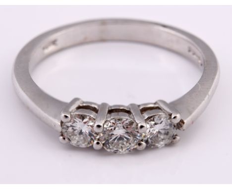 An 18ct white gold and three stone diamond ring, ring size M 1/2Diamond ring approx. 0.52ct 