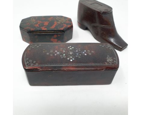 A 19th century lacquered snuff box, inlaid mother of pearl, 10 cm wide, a painted snuff box, 8 cm wide and a carved wood snuf