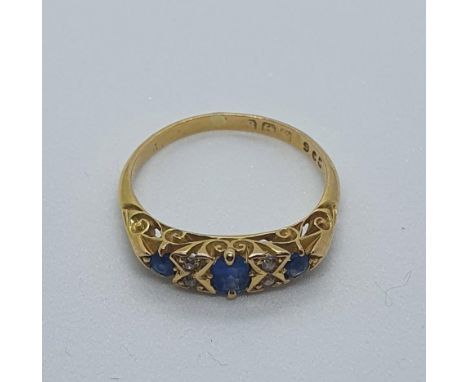 An 18ct gold, sapphire and diamond ring, ring size M 