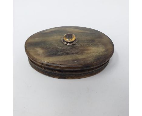 A 19th century horn oval snuff box, the top inset with a yellow gemstone, 10 cm wideFaded 