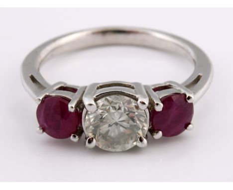 An 18ct white gold, ruby and diamond three stone ring, ring size KStone weight approx. 1.5ct 