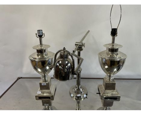 A pair of chrome table lamp, by Andrew Martin, 55 cm high and an adjustable table lamp, 49 cm (3)The wire has been cut off an