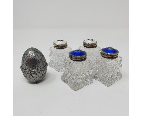 A pair of Continental cut glass inkwells, with silver coloured metal and blue enamel tops, another pair in white, a pewter no
