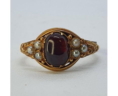 A 15ct gold, garnet and pearl ring, ring size N 