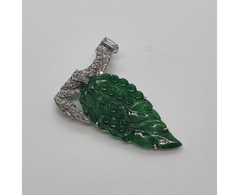 A platinum, jade and diamond brooch, in the form of a leafNo visible faults to naked eyediamond weight unknown  unmarkedjade 