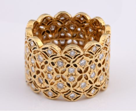 An 18ct and diamond set ornate band ring, ring size M 