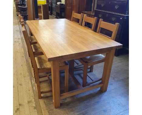 A Laura Ashley oak dining table and six matching chairs181 x 91 cm overall condition good with light wear due to use and age 