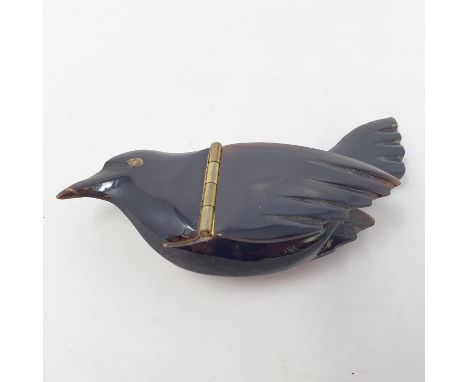An unusual 19th century carved horn snuff box, in the form of a bird, 9 cm wide 