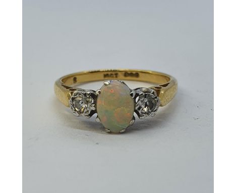 An 18ct gold, opal and diamond ring, ring size L 1/2 