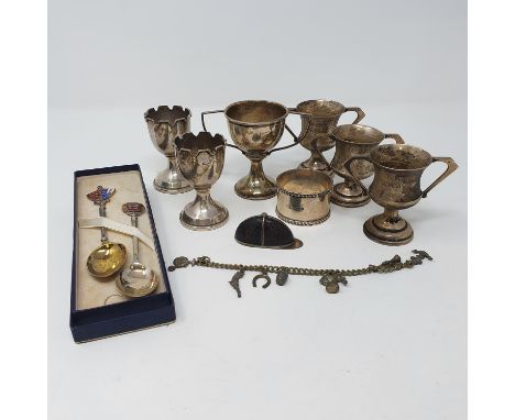 A pair of silver trophy cups, Birmingham 1938, 6 cm high, two other trophy cups, a napkin ring, three teaspoons, 6.7 ozt, a p