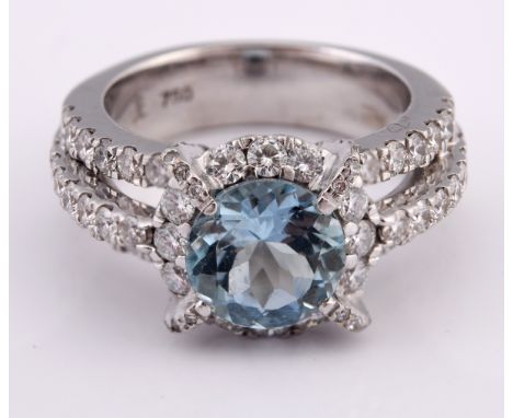 An 18ct white gold, diamond and aquamarine ring, ring size J 