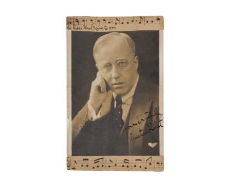 Holst, Gustav - a postcard printed with portrait photograph of the composer signed in ink 'Yours Gratefully Gustav Holst' and
