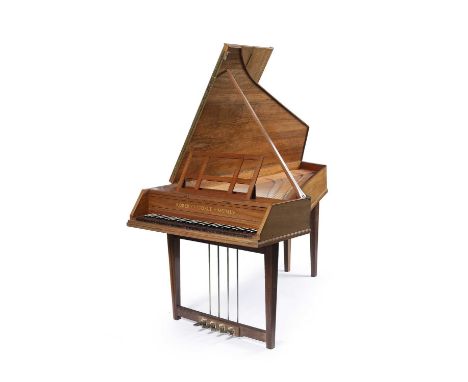 A walnut cased single manual harpsichord by Robert Goble, the fascia panel inscribed with makers name and dated 'MCMLV' (1955