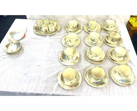 Crown staffordshire floral holyhock pattern part tea service includes 12 cups, 12 saucers, 12 plates , 5 coffee cups etc