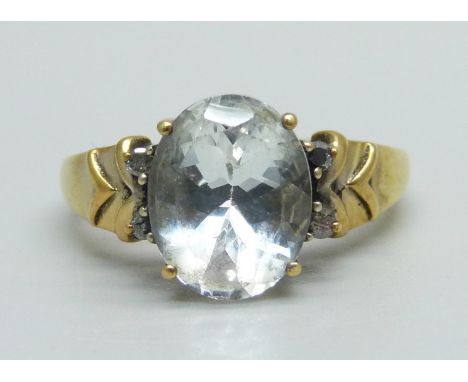A silver gilt and rock crystal set ring with diamond shoulders, O 
