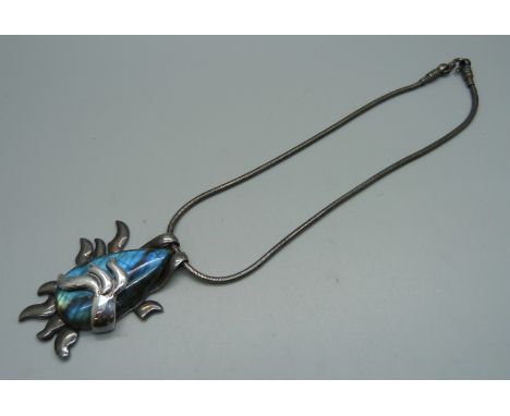 A silver necklace set with labradorite 