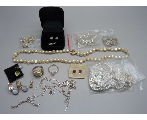 A collection of silver jewellery, chains and a string of pearls 