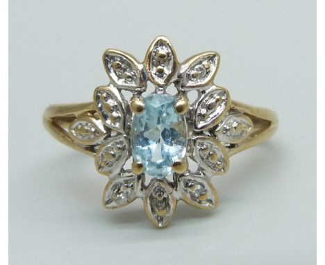 A 9ct gold, diamond and blue stone ring, 1.9g, J/K 