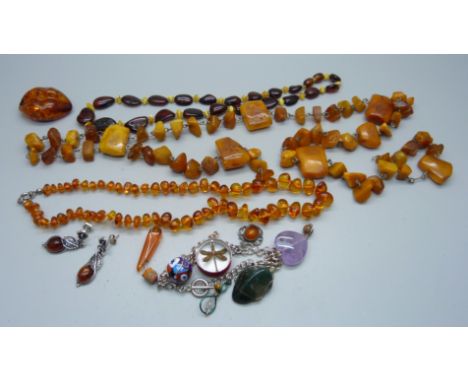 A collection of amber jewellery and a pair of silver mounted amber earrings 