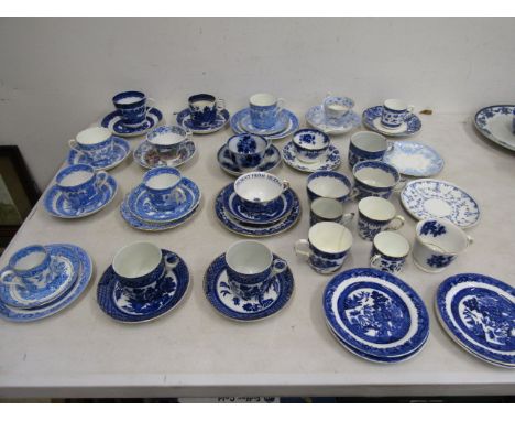 A quantity blue &amp; white tea cups and saucers/cups etc
