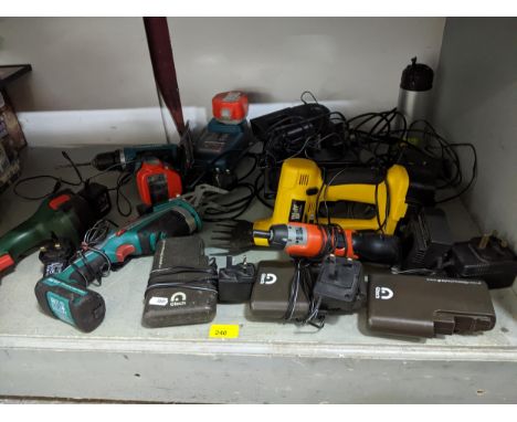 A group of electric and battery power tools to include a Bosch PSR1200 cordless drill, and a Bosch Isio hand held hedge trimm