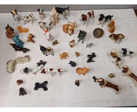 A collection of mainly ceramic model dogs to include Sylvac, Beswick and othersLocation: 